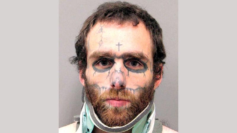 This undated booking photo provided by the Henderson Police Department shows Christopher...